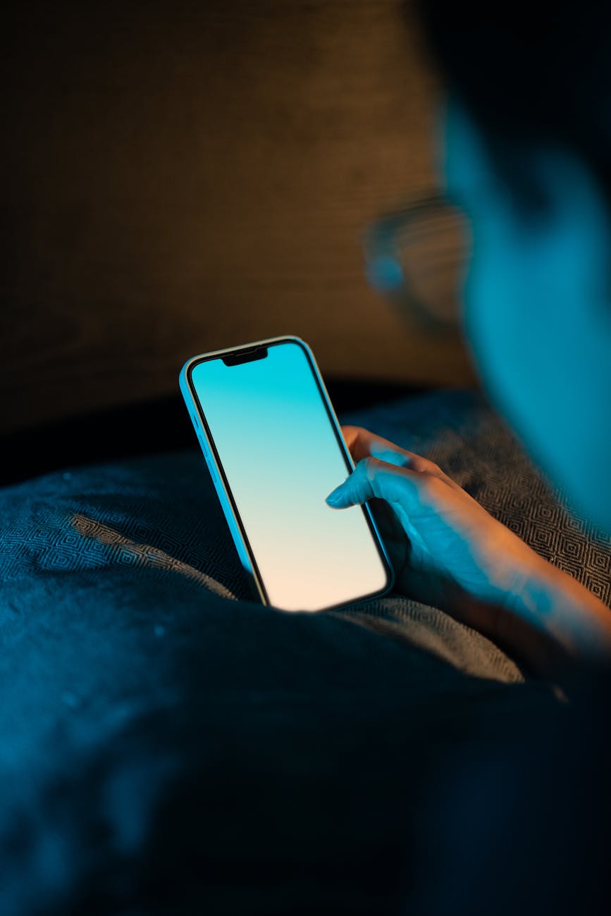 a hand holding a smartphone